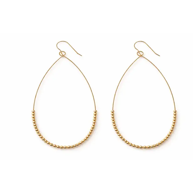 Gold-filled minimalist teardrop earring by erin gray, showcasing sleek, modern jewelry design with a smooth teardrop shape.