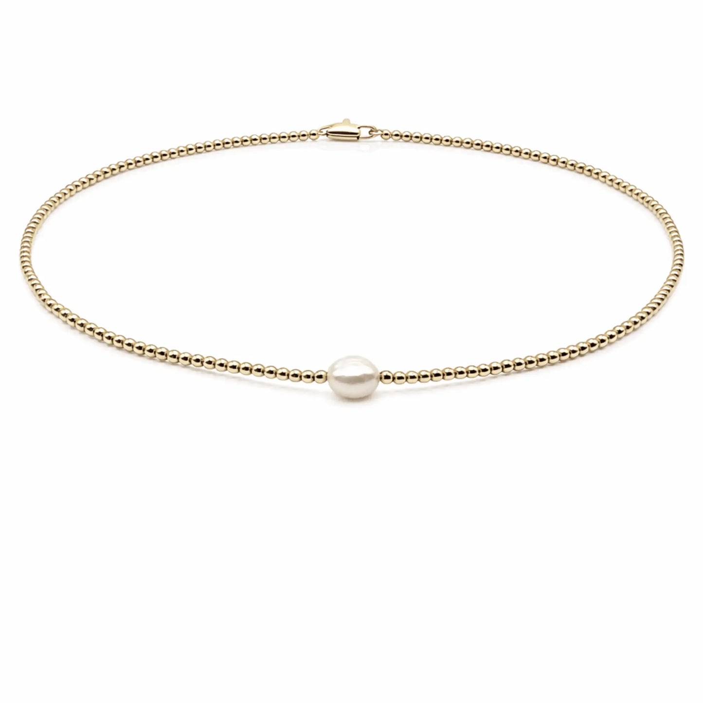 14k gold-filled jewelry necklace with a single baroque pearl, featuring a 2mm chain and elegant design by erin gray.