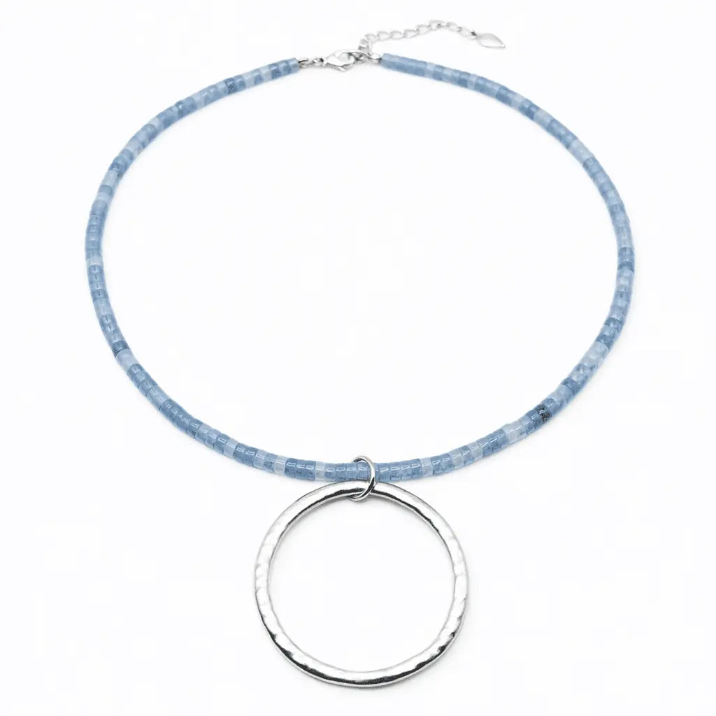 Silver Heishi necklace by erin gray featuring aquamarine beads, showcasing a stylish, handcrafted jewelry piece.