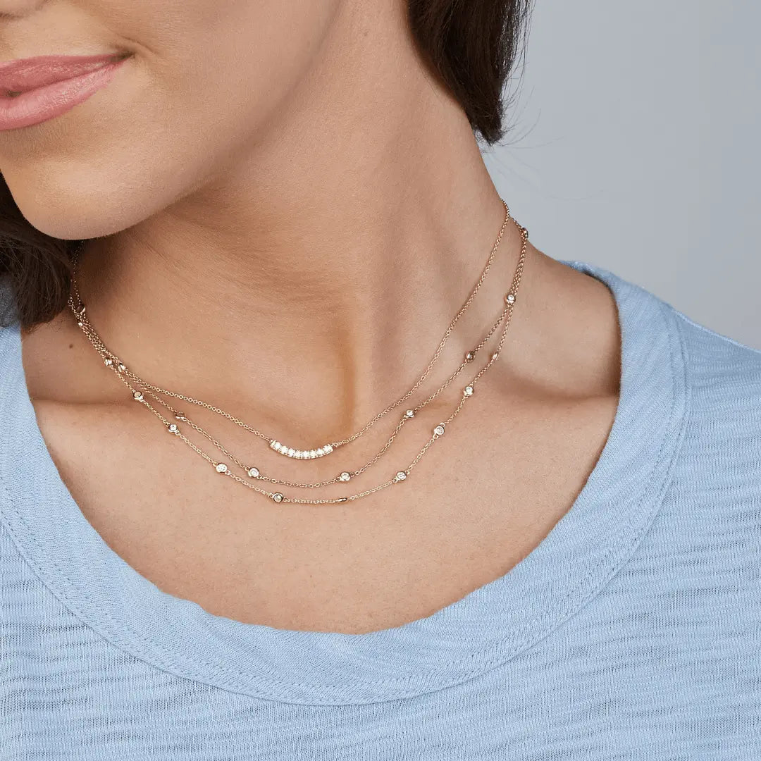 Diamond bar pendant on 14k gold necklace by Erin Gray, showcasing a sleek and elegant jewelry piece.