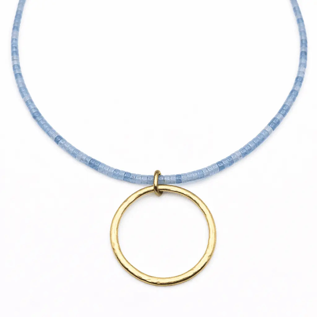 erin gray Heishi "Big Gold" Necklace in aquamarine with gold-colored beads and a stylish, layered jewelry design.