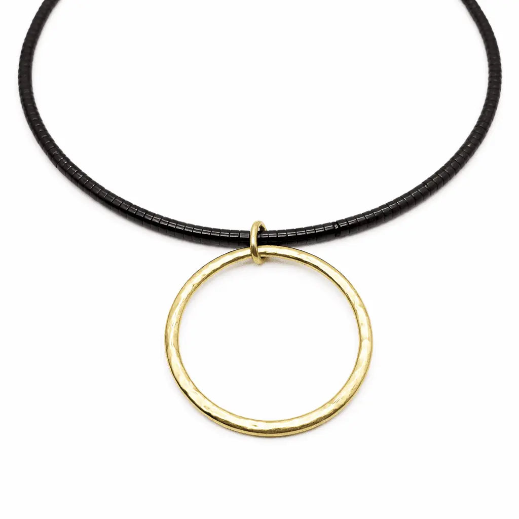 Black Heishi "Big Gold" necklace by erin gray featuring large, glossy black beads and gold accents, jewelry accessory.