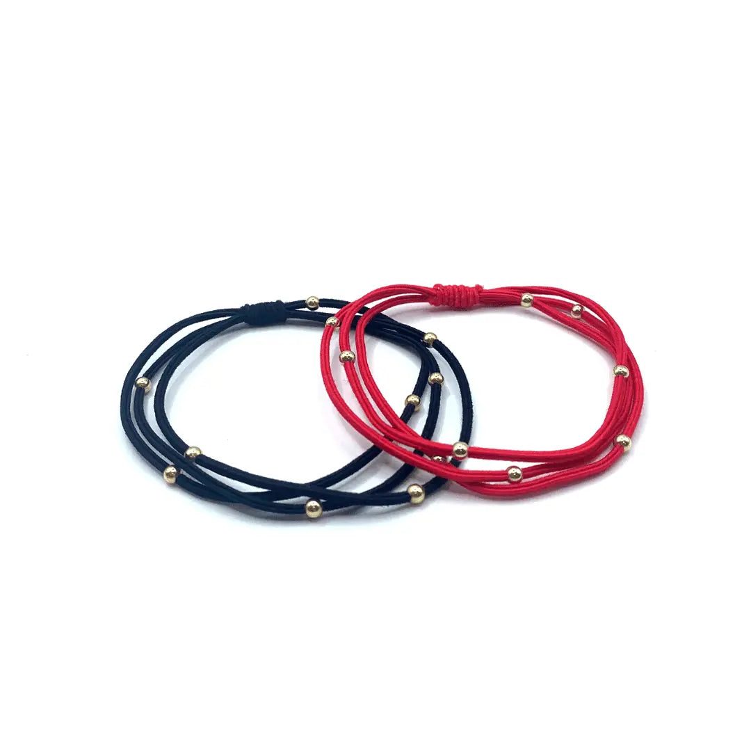 Red and black waterproof bracelet hair bands by erin gray, 3mm gold water pony style hair accessory for securing hair.