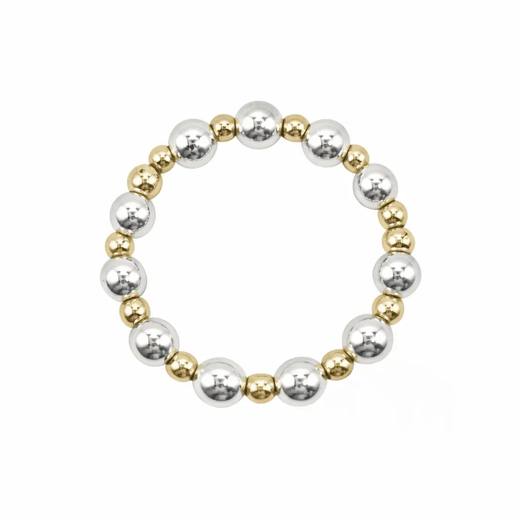 Sterling silver 4mm and gold-filled 2mm beaded waterproof stretch ring, jewelry by Erin Gray, close-up of beaded design.