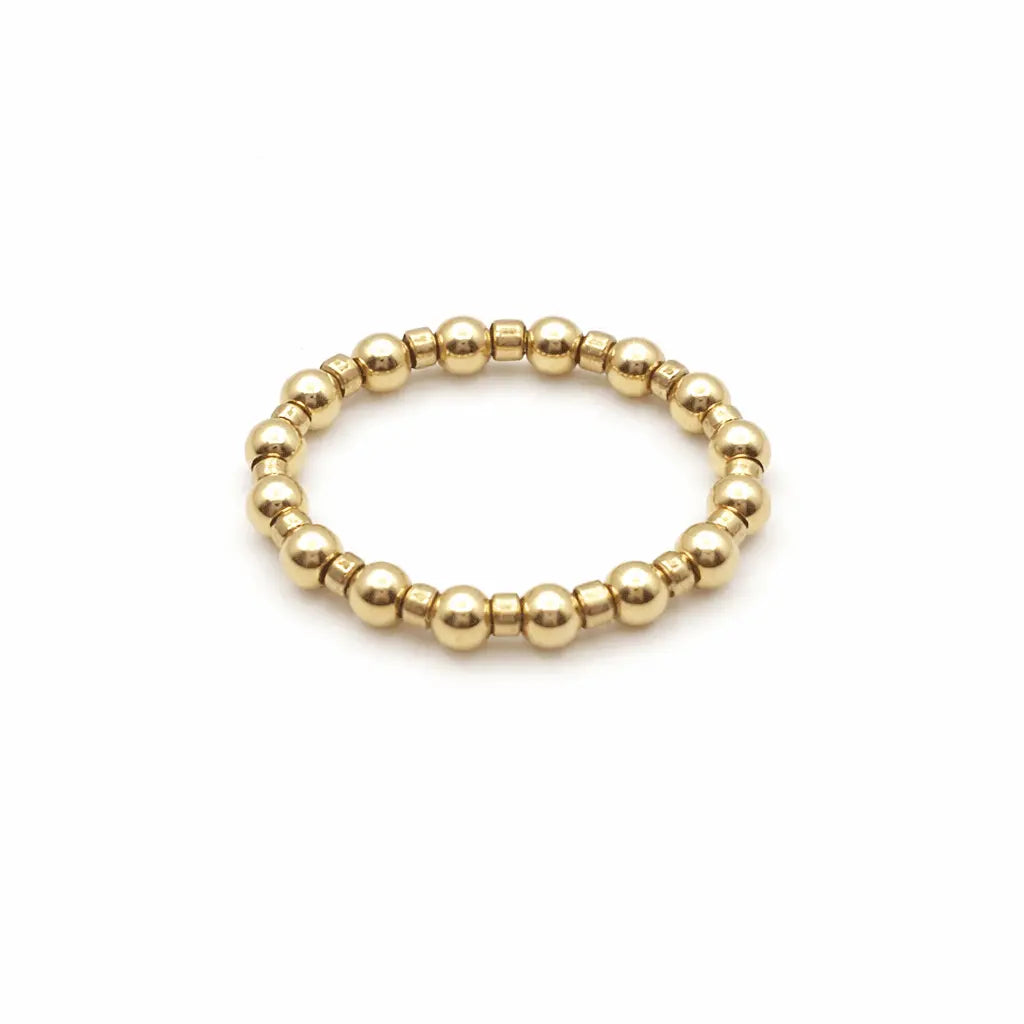 Gold-filled waterproof stretch ring with a 3mm color crush Newport design, featuring a sleek, modern style in golden tones.