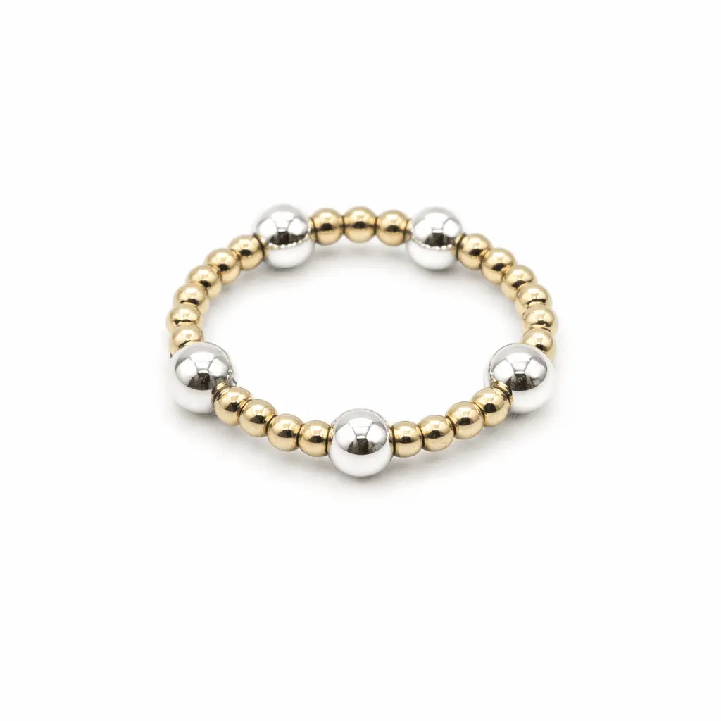 Sterling silver and gold-filled beaded waterproof stretch ring from erin gray with 4mm and 2mm beads, jewelry accessory.