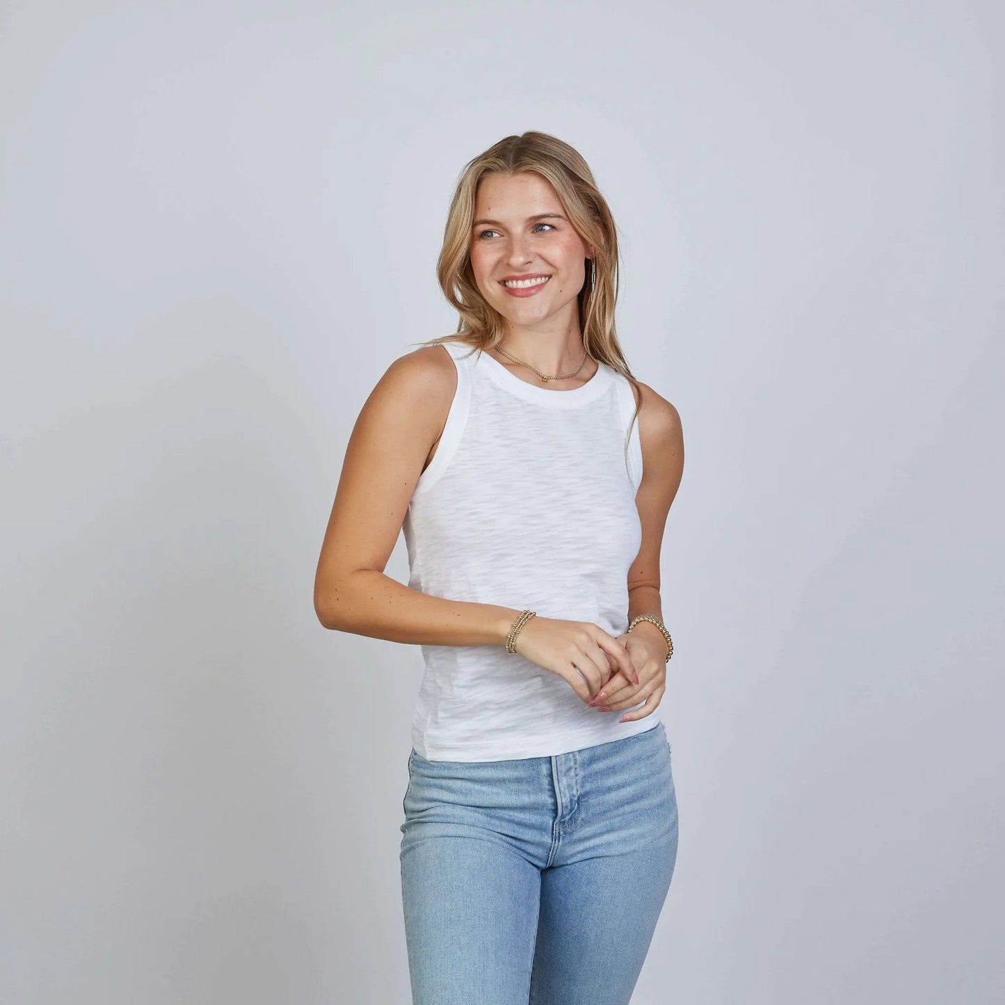 White cotton tank top with high neckline from erin gray, styled as everyday casual apparel.