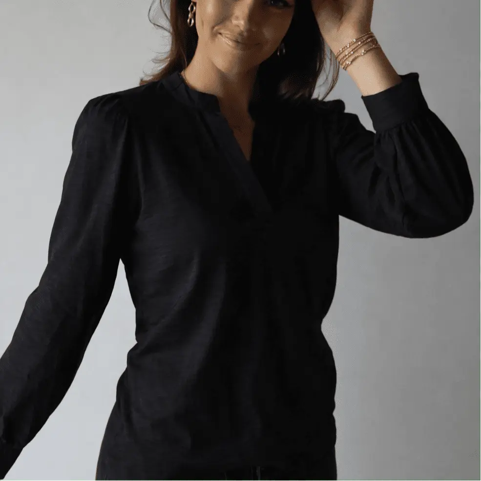 Black long sleeve Dolly Top by erin gray, featuring a stylish, fitted design perfect for casual or dressy wear.