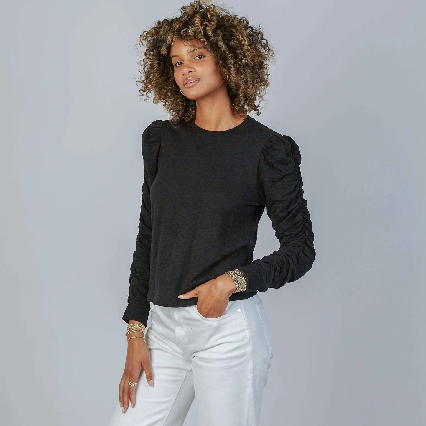 Black Elle ruched long sleeve tee by Erin Gray, featuring fitted design and ruched detail on the sleeves.