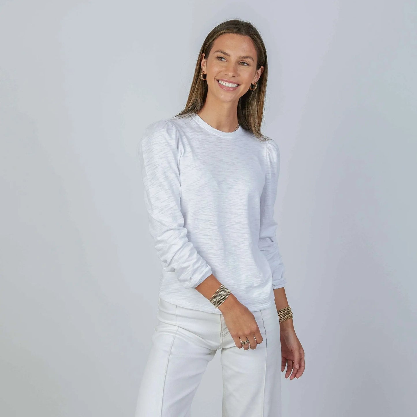 White Elle Ruched Long Sleeve Tee by erin gray, featuring a fitted design and ruched details on the sleeves.