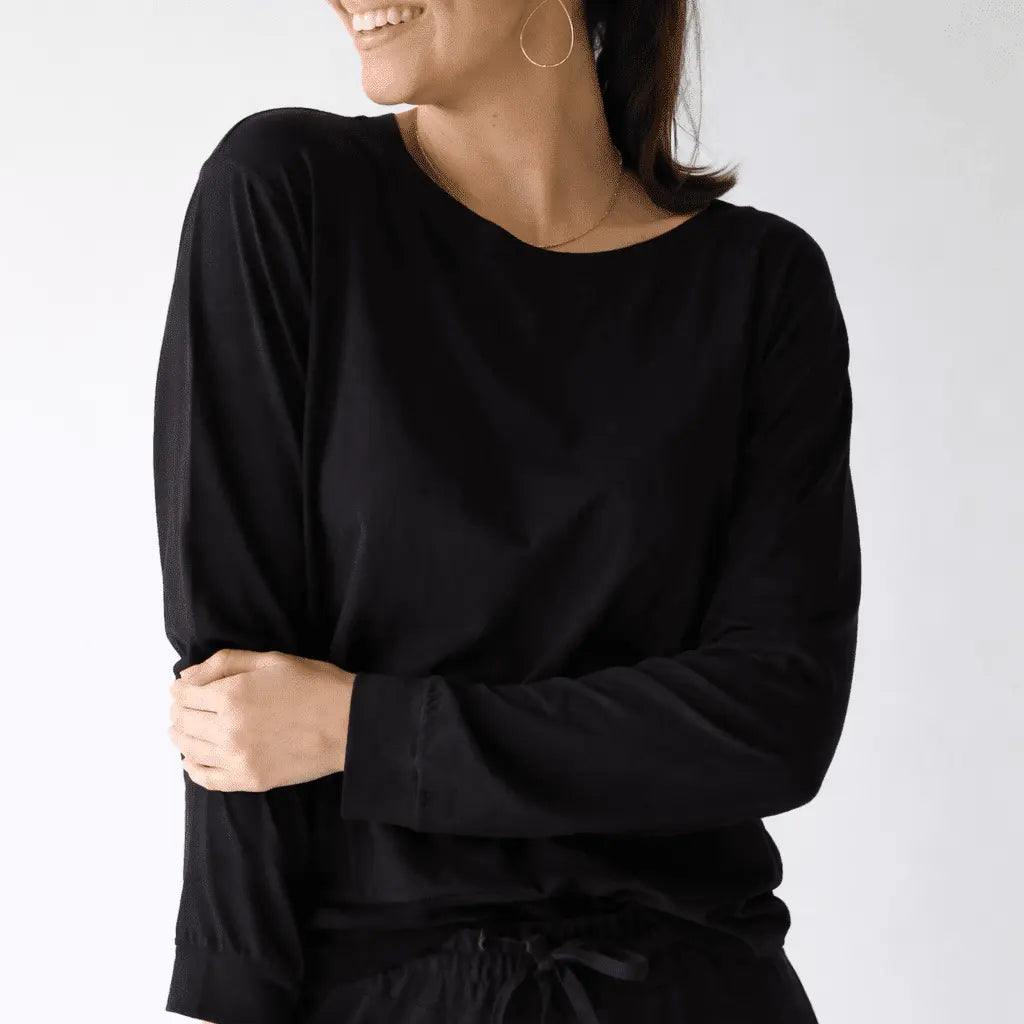 Black and khaki long sleeve Studio Tee by erin gray, made from soft, comfortable fabric, shown laid flat on a neutral background.