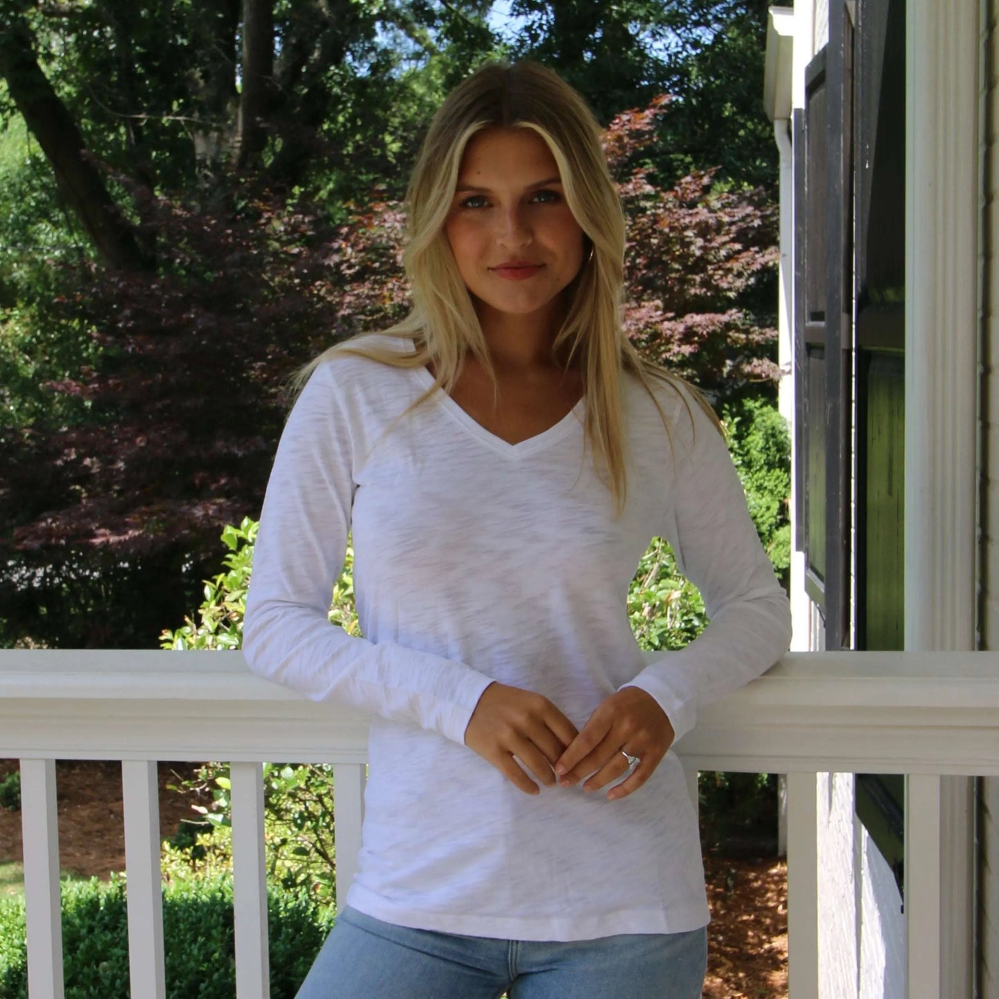 White long sleeve V-neck top in Pima cotton slub by erin gray, showcasing soft fabric and casual, comfortable style.