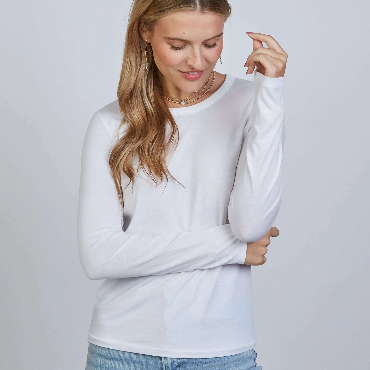 White long sleeve Weekender Tee by erin gray, casual apparel with a relaxed fit, shown on a model.