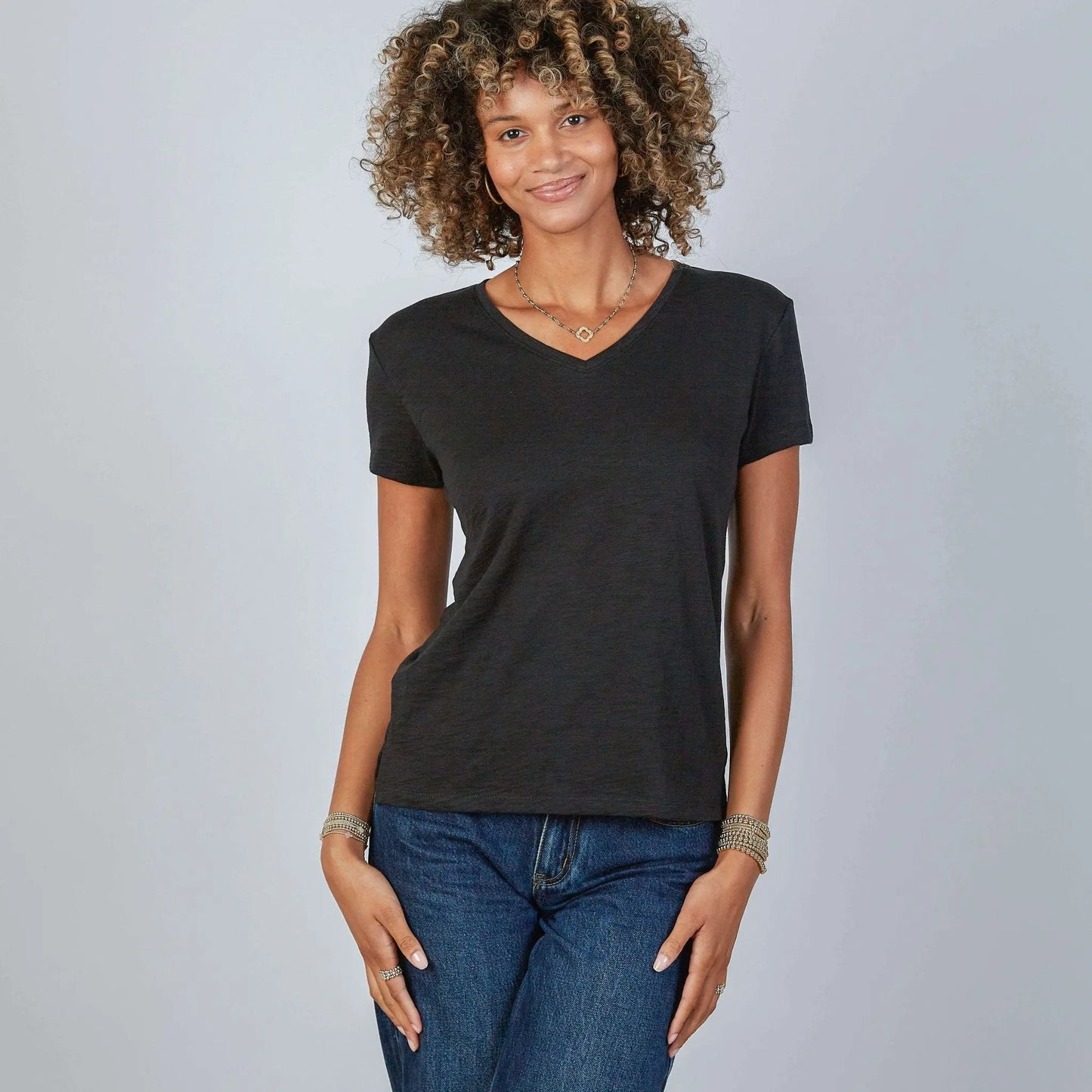 Black short sleeve jeans V tee shirt by erin gray, showcasing a casual, fitted apparel top with a V-neck design.