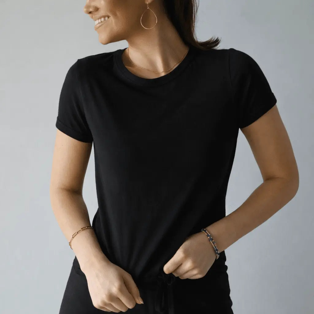 Black polished short sleeve tee by erin gray, showcasing a sleek, fitted apparel design with smooth fabric and clean finish.