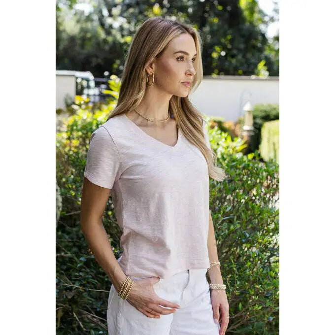 Vintage pink low-key V-neck apparel by erin gray, featuring a soft, relaxed fit and classic design, perfect for casual wear.
