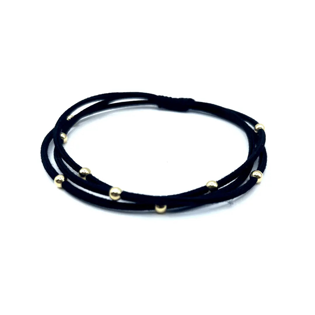 Black waterproof hair band by erin gray, Single Water Pony 3mm gold hair accessory for secure, stylish hair styling.