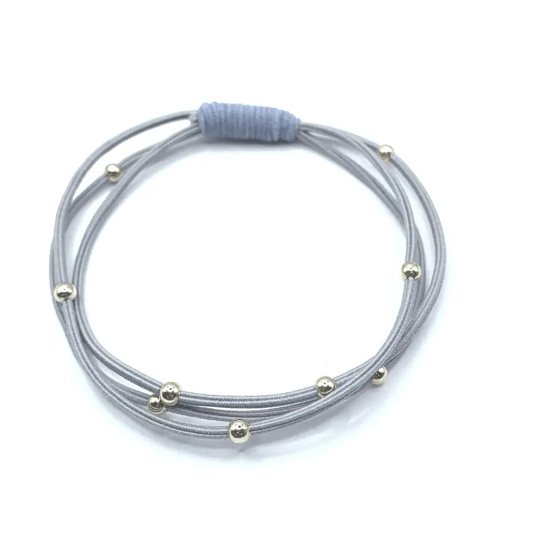 Gray and light blue waterproof hair band by erin gray, single Water Pony 3mm gold hair accessory for secure, stylish hair styling.
