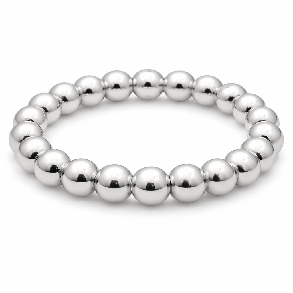 Sterling silver 4mm waterproof stretch ring by Erin Gray, smooth and shiny jewelry piece on a plain background.