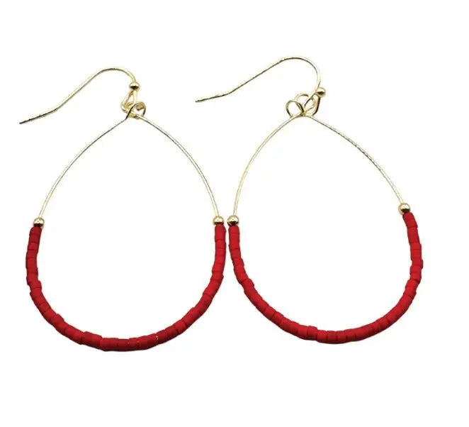 The Crimson Aster Game Day Earrings feature teardrop shapes with gold wire and small red beads on the lower half plus hook clasps—perfect team color jewelry for game day.