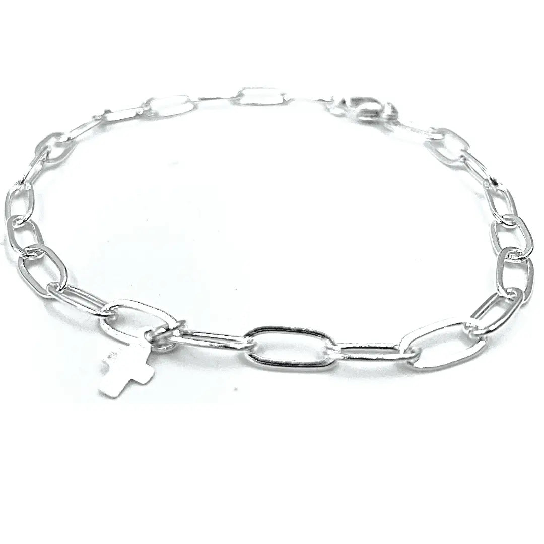 Sterling silver Essential Links Bracelet by erin gray featuring a luxe cross pendant, stylish jewelry accessory.