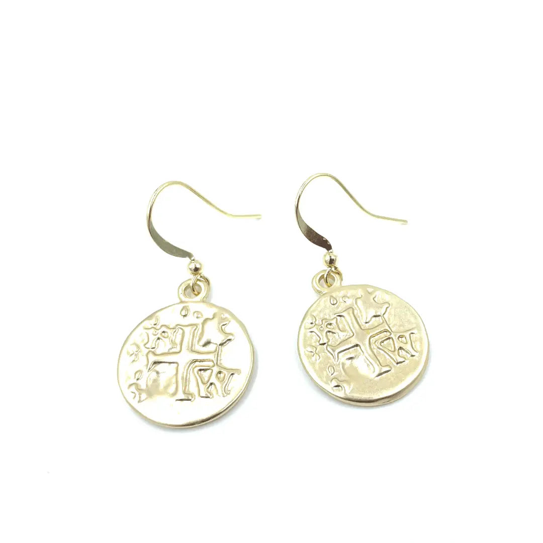 Brushed gold coin earring by Erin Gray, showcasing a round jewelry piece with textured gold finish on a clean background.