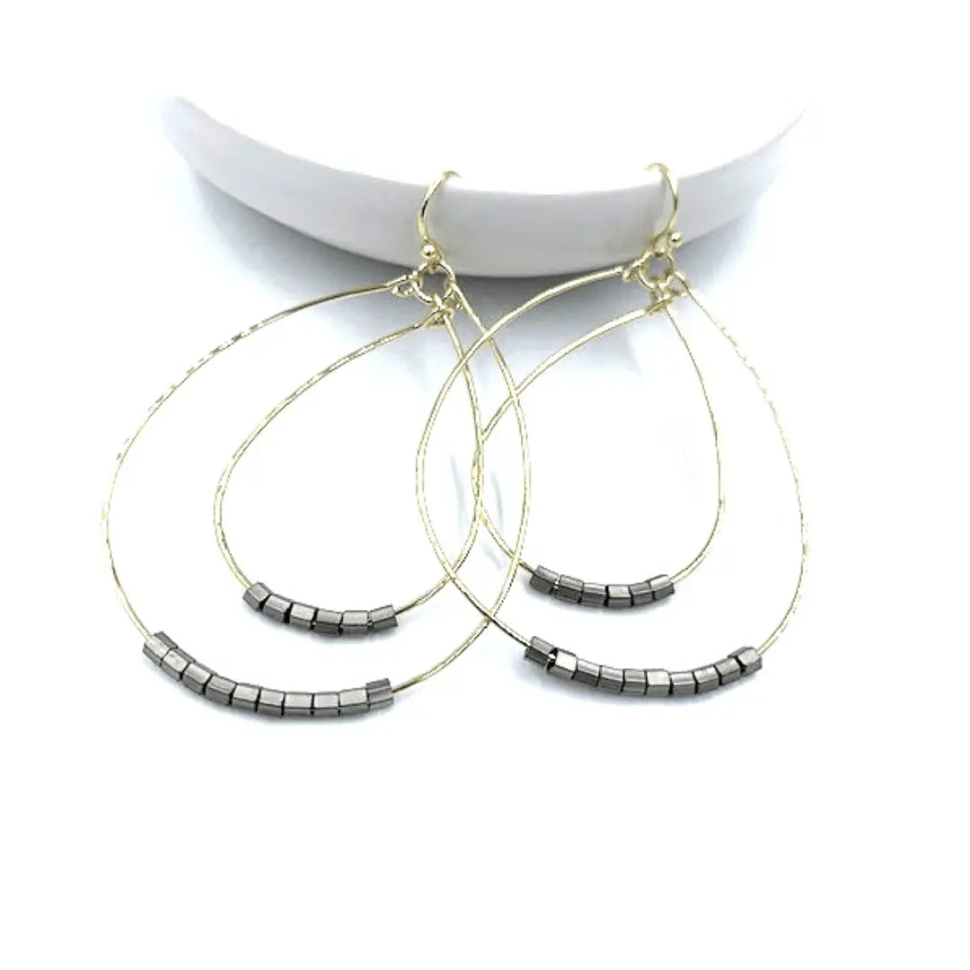 Ella Cate pewter earrings by erin gray, showcasing elegant jewelry design with smooth, metallic pewter finish and stylish shape.