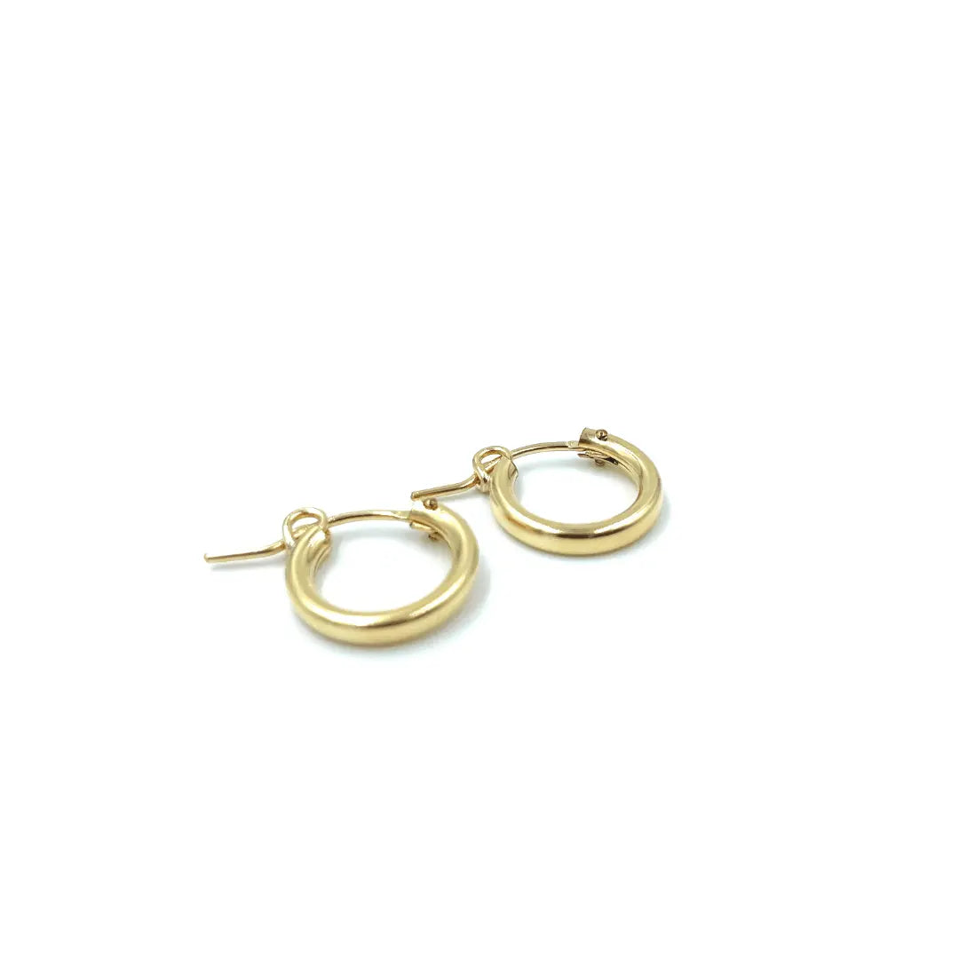 14k gold-filled 13mm hoop earring by erin gray, showcasing a sleek, polished jewelry design with a classic circular shape.