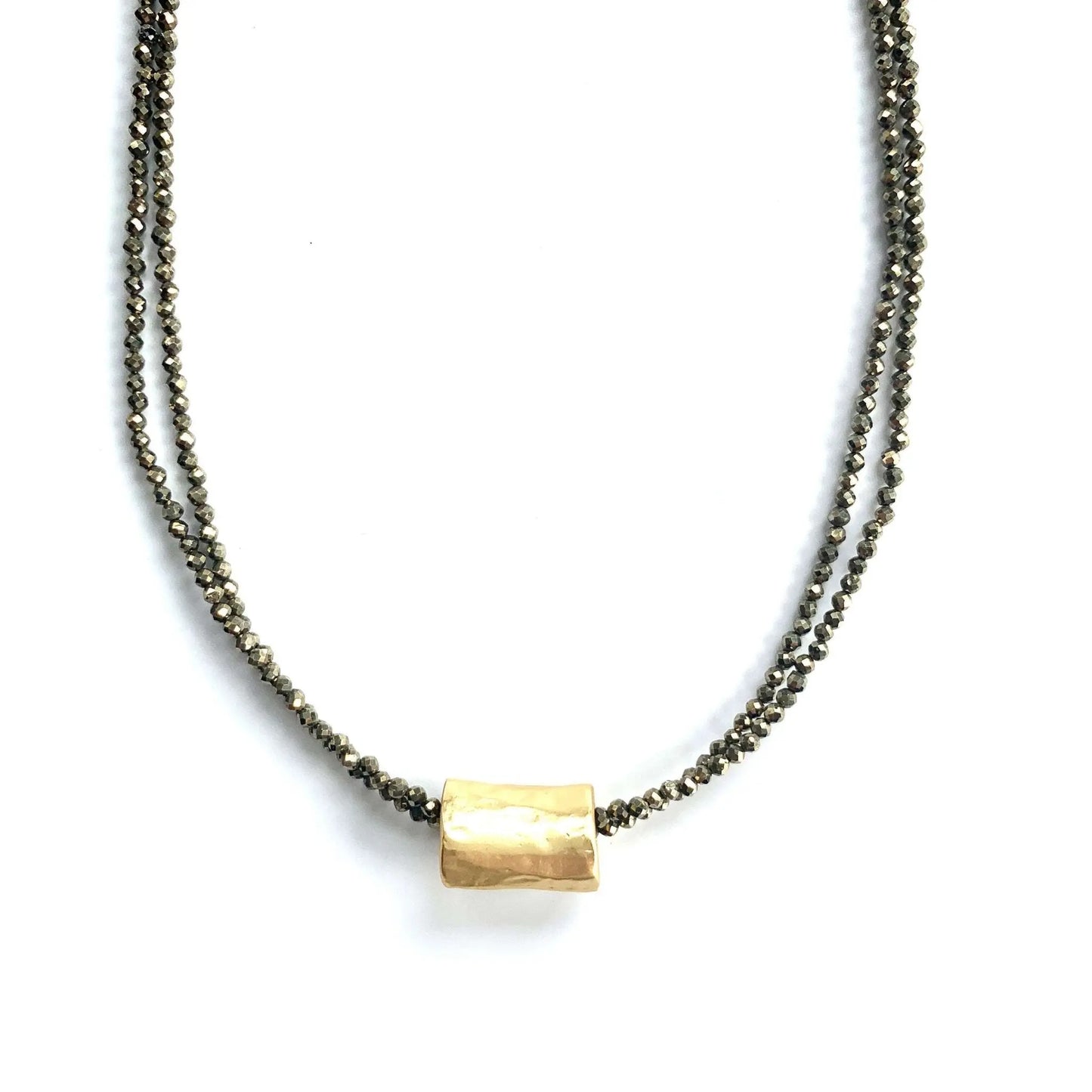 Erin Gray jewelry featuring a barrel-shaped pendant on a double pyrite beaded necklace, close-up view of the necklace design