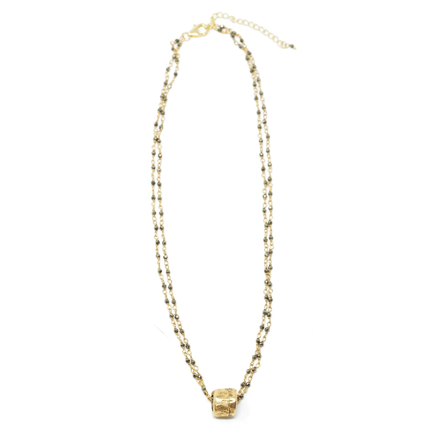 Small gold barrel pendant on double pyrite gemstone necklace by erin gray, showcasing elegant jewelry design.