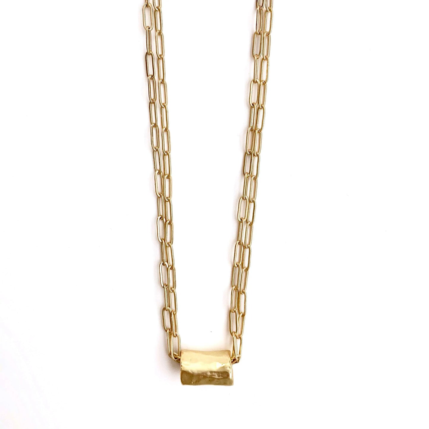 Gold jewelry necklace featuring a barrel-shaped pendant on double gold paperclip chain by Erin Gray.