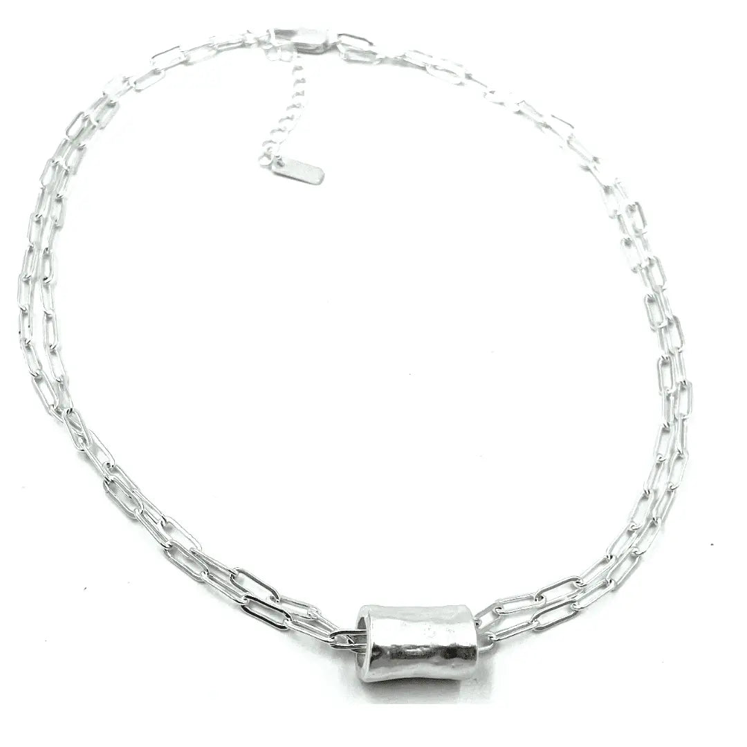 Silver barrel pendant on a double silver paperclip chain necklace by erin gray, showcasing elegant jewelry design.