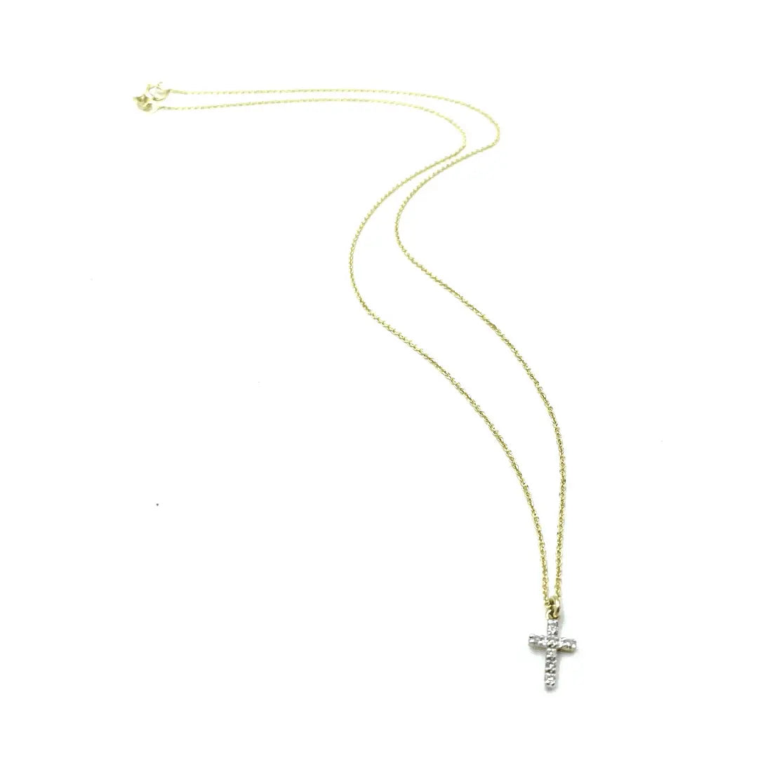 Diamond cross pendant on 14k gold necklace by Erin Gray, featuring a sparkling diamond accent and delicate gold chain.