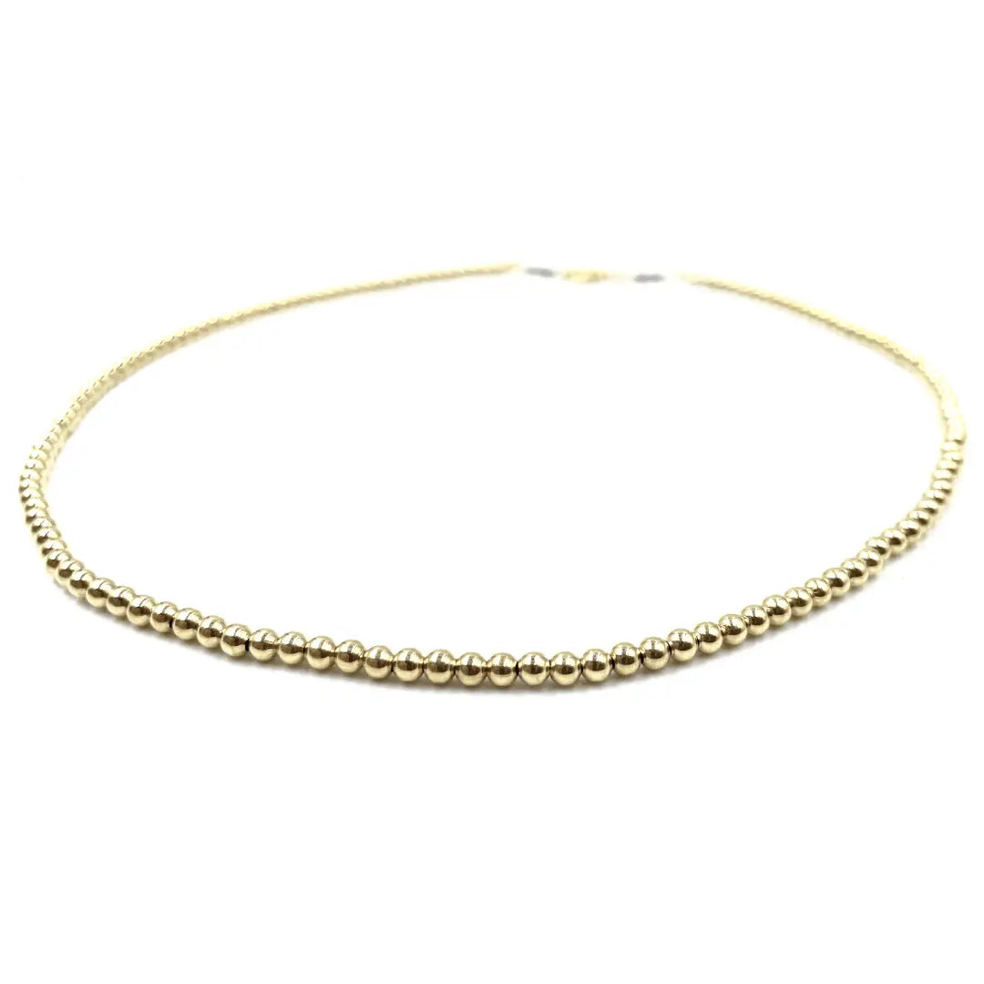 14k gold filled waterproof beaded necklace by Erin Gray, featuring a sleek 3mm chain for elegant jewelry wear.