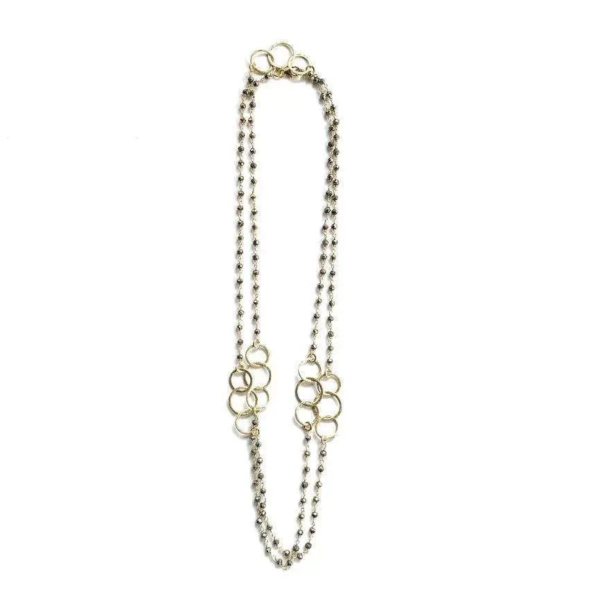 Gold Peace and Love Long Necklace by erin gray featuring a delicate chain and pendant with peace and love symbols.