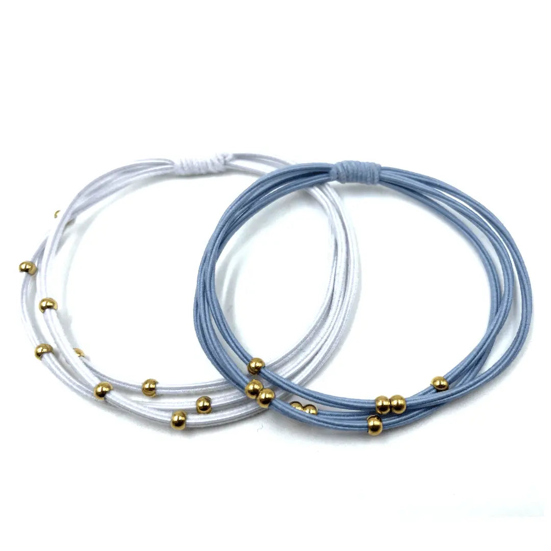 Light blue and white 3mm gold water pony waterproof bracelet hair bands by erin gray, stylish hair accessory for various hairstyles.