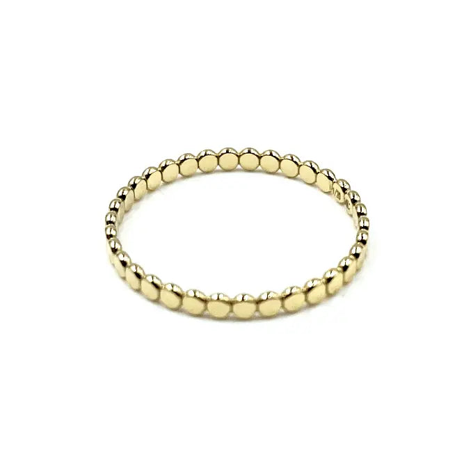 Gold flat pebble ring from erin gray's Resort Collection, showcasing a sleek waterproof jewelry design.